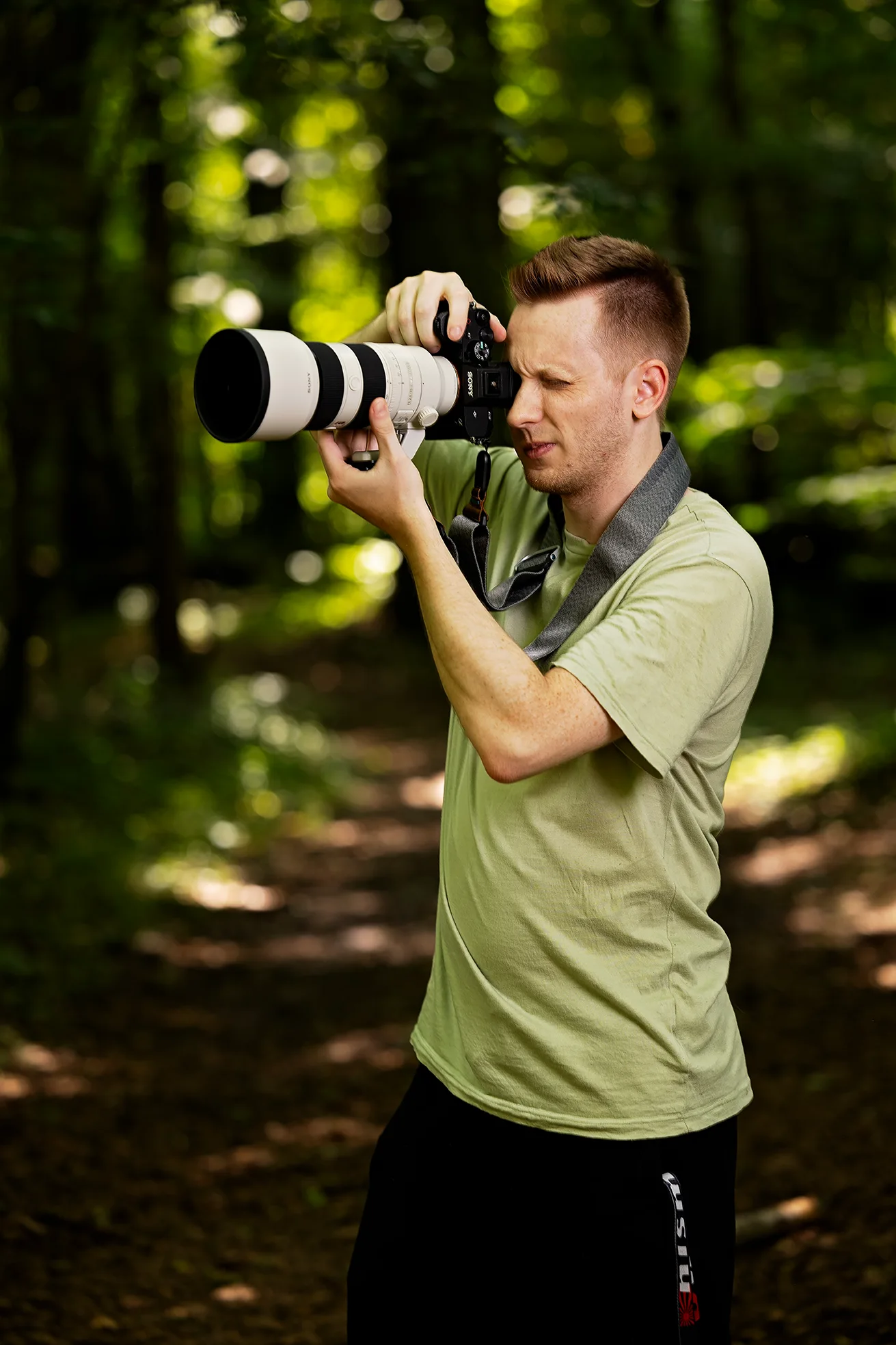 Portrait of Birmingham wedding photographer Eric Lucky in a black tuxedo
